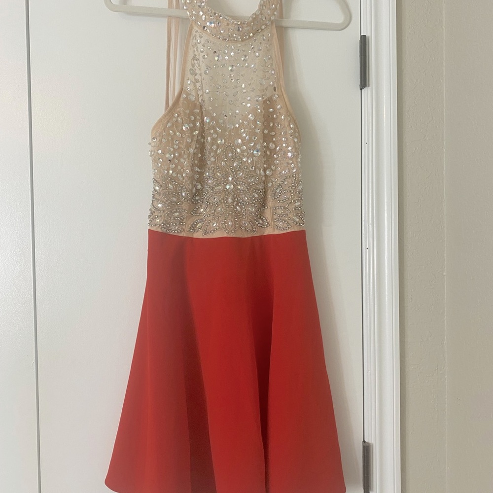 Cream and red sequence dress